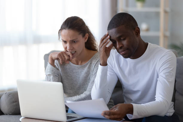 istock Nervous African American couple checking financial documents, bills 1249263138