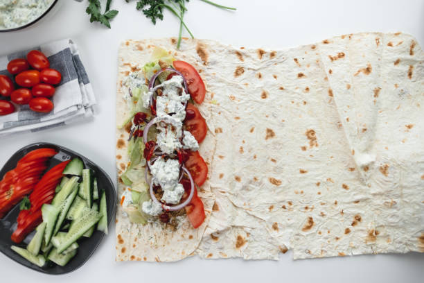 istock Cooking chicken roll with meat, fresh vegetables, herbs and sauce. 1249268082
