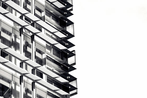 istock Black and white modern office building, skyscrapers, white background with copy space 1249273176