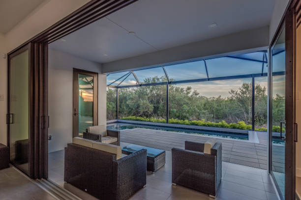 istock Covered patio with glass wall that opens to the inside 1249283000