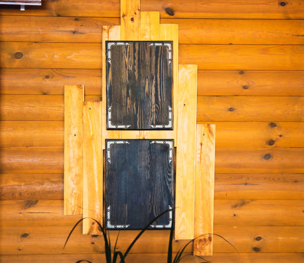 Empty wooden plaque on a wooden background