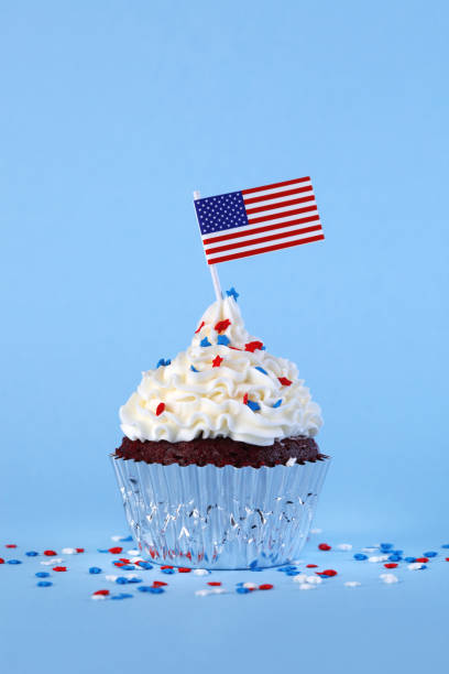 istock 4th of July cupcake with flag and sprinkles 1249284462