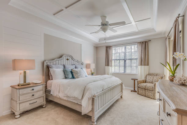 istock Beautifully decorated master bedroom with white and light brown tones 1249284471