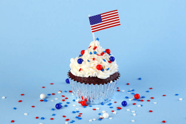 istock 4th of July cupcake with flag and sprinkles 1249284485