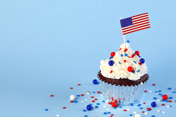 istock 4th of July cupcake with flag and sprinkles 1249284490