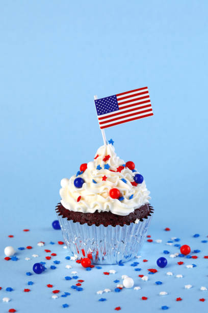 istock 4th of July cupcake with flag and sprinkles 1249284499