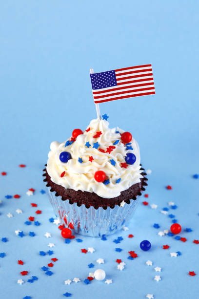 istock 4th of July cupcake with flag and sprinkles 1249284513