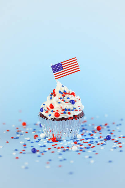 istock 4th of July cupcake with flag and sprinkles 1249284522