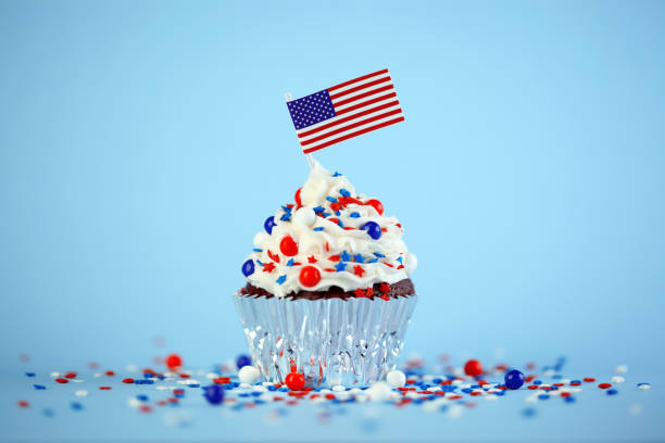 istock 4th of July cupcake with flag and sprinkles 1249284539