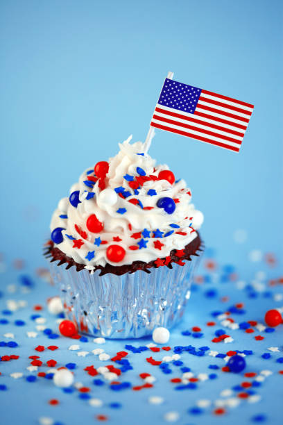 istock 4th of July cupcake with flag and sprinkles 1249284547