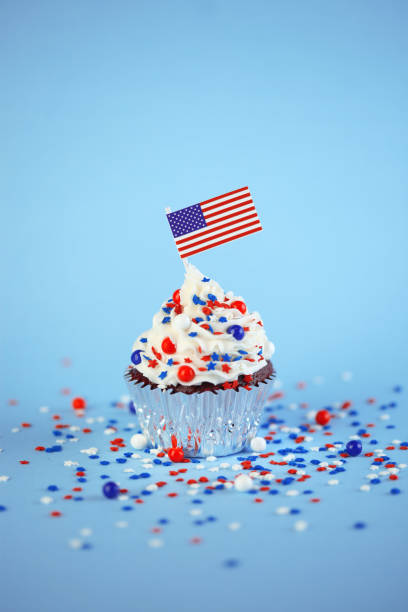 istock 4th of July cupcake with flag and sprinkles 1249284555