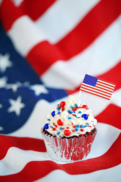 istock 4th of July cupcake with flag and sprinkles 1249284566