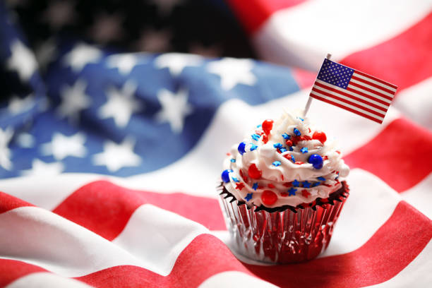istock 4th of July cupcake with flag and sprinkles 1249284586