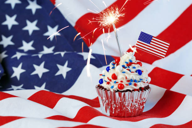 istock 4th of July cupcake with flag and sprinkles 1249284629