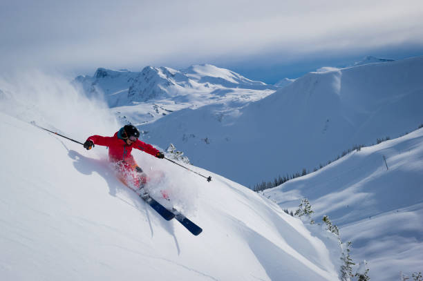 istock Woman skiing fresh powder on a ski vacation 1249286116