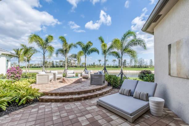 istock Outdoor firepit and lounge area surrounded by palm trees 1249289111