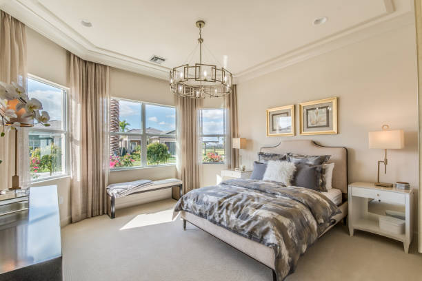Spacious bedroom in tour home Elegant staged furnishings in master bedroom owners bedroom photos stock pictures, royalty-free photos & images