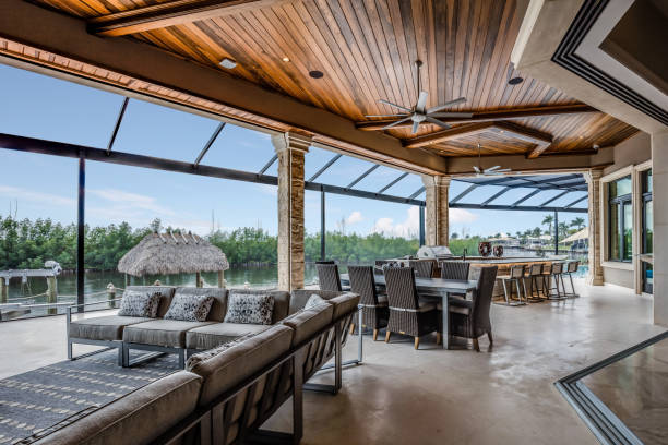Stunning covered patio of multi-million dollar mansion Outside living area designed for hosting and entertaining enclosure stock pictures, royalty-free photos & images