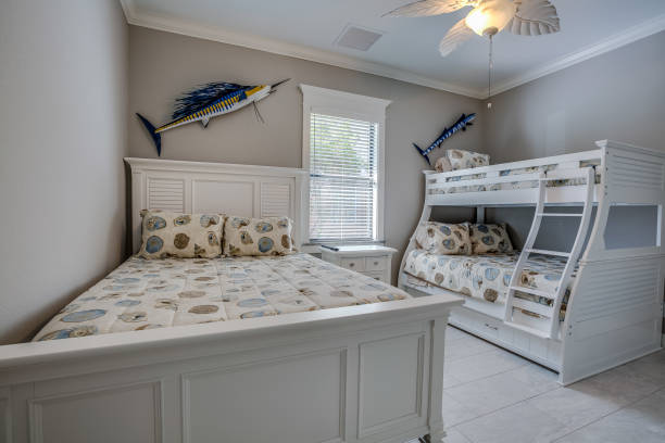 Bunk bed room with tropical style decor