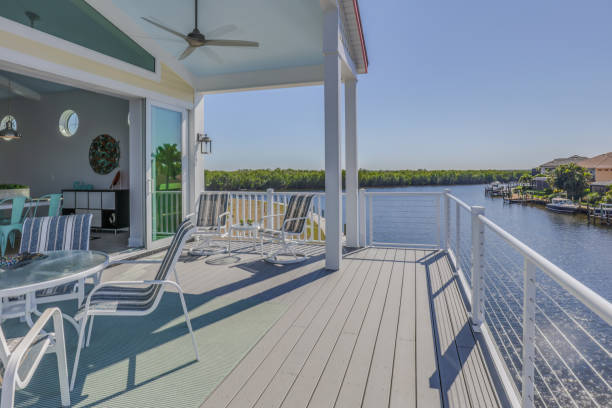 istock Large deck of Florida home looking over a canal 1249291119