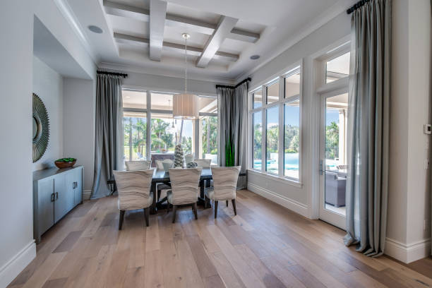 Dining area surrounded by many tall windows to add elegance and natural light