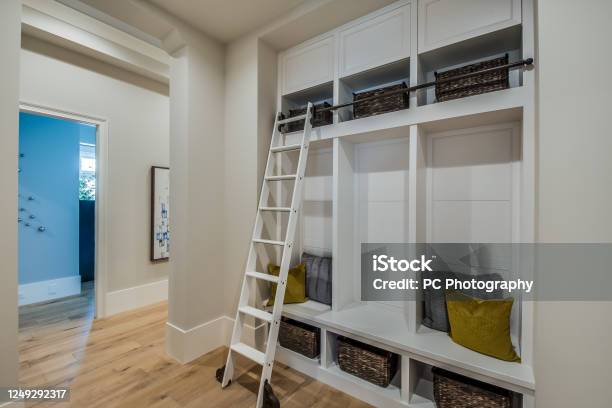 Mudroom With Built In Shelves And Cubbies Stock Photo - Download Image Now - Mudroom, Basket, Cabinet