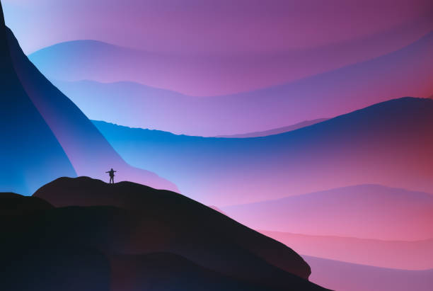young man standing on top of the mountain
