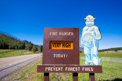 Jemez Springs, NM: A roadside fire danger sign (“Very High”) featuring Smokey the Bear.n
