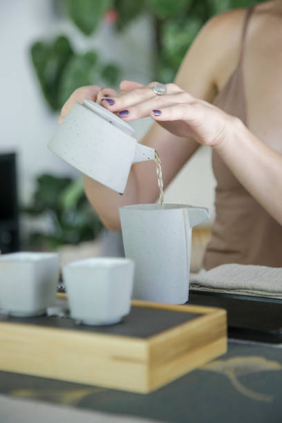 istock Chinese Tea Ceremony experience. Exquisite hot tea at traditional Chinese Tea Ceremony. Caucasian woman participating in a traditional tea ceremony class. 1249313897