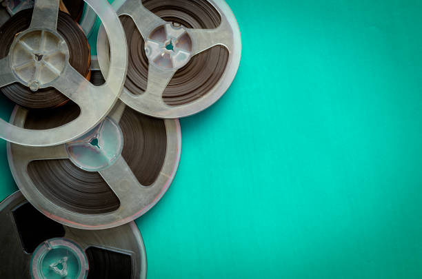 istock Reels with a magnetic tape on turquoise. 1249317981