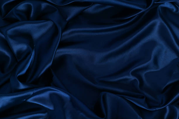 istock Texture Satin ripple fabric Blue cloth simple surface used us luxury backdrop products design 1249318966