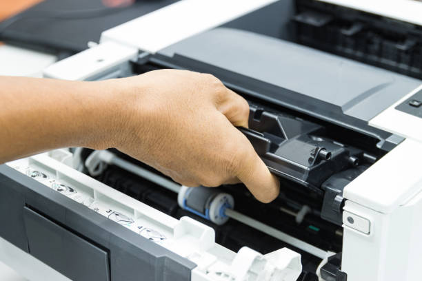 istock Technicians replacing toner in laser printer concept office supplies repair 1249320690