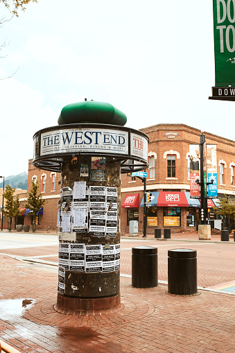 Boulder, Colorado - May 27th, 2020: Flyers and advertisements posted on signpost along Pearl Street Mall