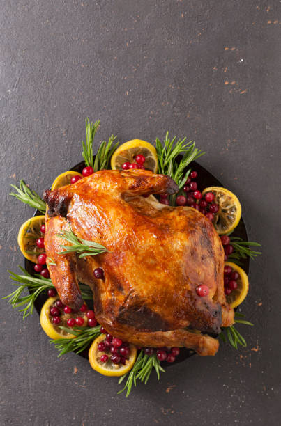 istock Christmas table with baked turkey or chicken, copy space for text. Christmas dinner, top view 1249322960