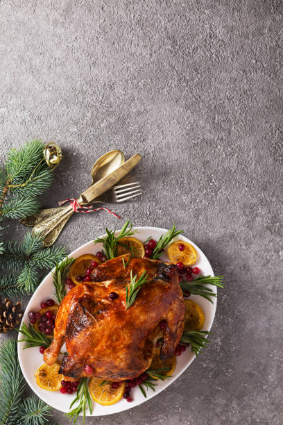 istock Christmas table with baked turkey or chicken, copy space for text. Christmas dinner, top view 1249322977