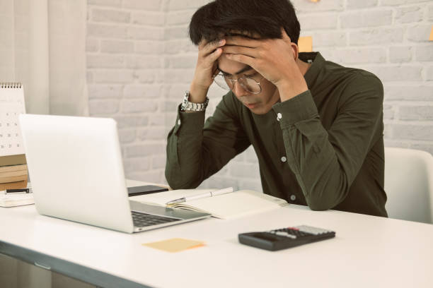 istock man freelancer feeling tired frustrated stressed from hard work. exhausted businessman have headache 1249323021