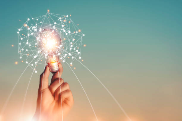New ideas and imagination Creativity and inspiration Technological innovation. New ideas and imagination Creativity and inspiration Technological innovation. Hand holding brain digital network and abstract science light bulb inside on networking connection on sky background. simile pic stock pictures, royalty-free photos & images