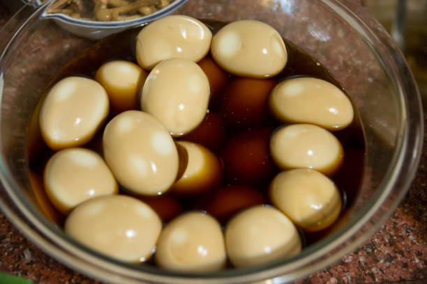 Bowl of Medium-Boiled Eggs, marinated in a Japanese sauce containing Soy and Mirin stock photo