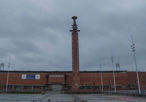 das olympiastadion in amsterdam, holland - olympic torch stock-fotos und bilder