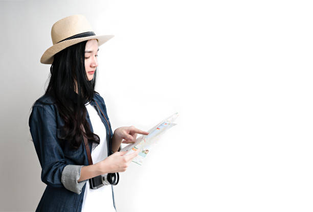 Asian woman holding map for travel plan