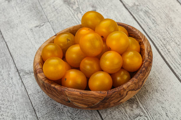 istock Fresh yellow cherry tomato heap 1249334642
