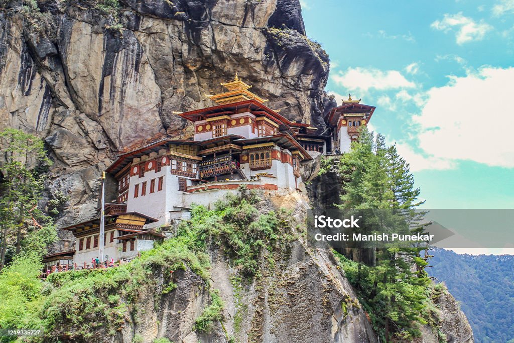 Tiger's Nest Tiger's Nest or Paro Taktsang is a very important Buddhist sacred temple complex. It is located on the cliffside of the upper Paro valley in Bhutan. It is one of the most visited places in Bhutan. Monastery Stock Photo