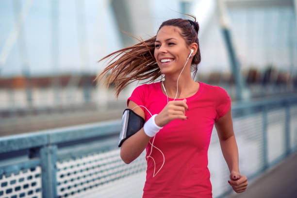 istock Woman running outdoors. 1249336570