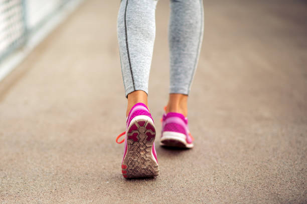istock Woman running outdoors. 1249336635