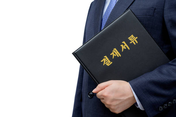 istock A businessman holding the file for approval. 1249337796