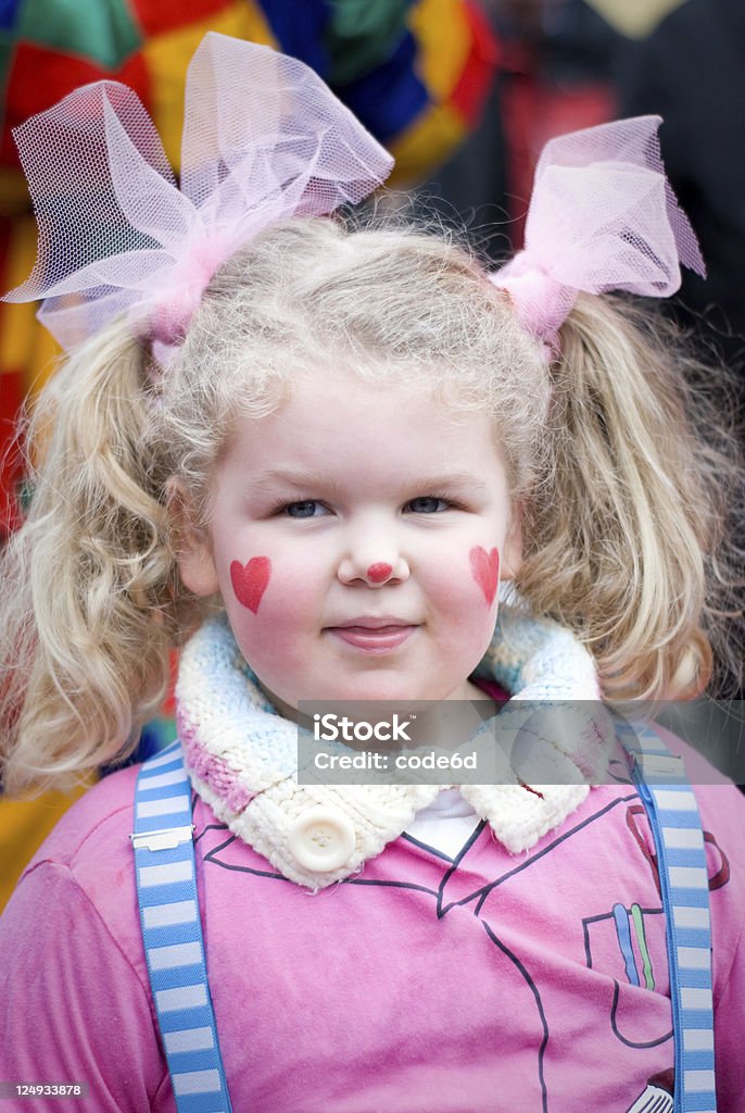 Girl wearing clown's costume, Carnival in Cologne A 3-4 year-old girl dressed as a clown during the Cologne Rosenmontag parade, a traditional German carnival parade Child Stock Photo