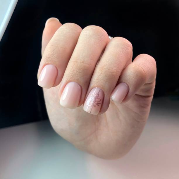 istock manicure and floral design on women's nails. 1249338826