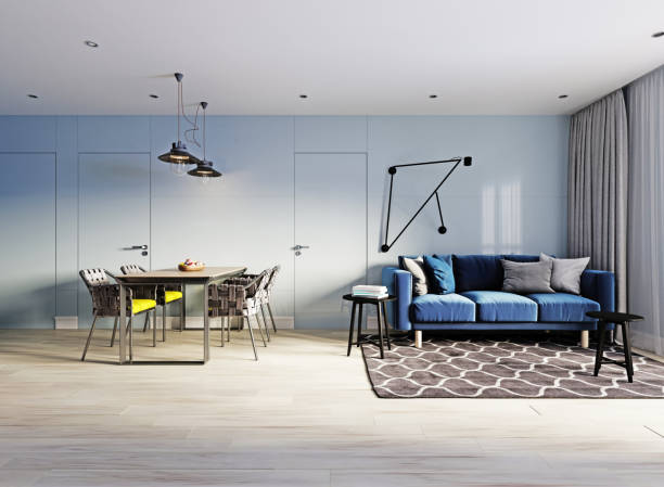istock small studio apartment with kitchen, dining room and living room with sofa. Interior in blue and white colors and wooden elements. 1249339735