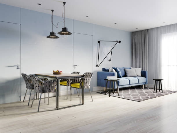 istock small studio apartment with kitchen, dining room and living room with sofa. Interior in blue and white colors and wooden elements. 1249340509