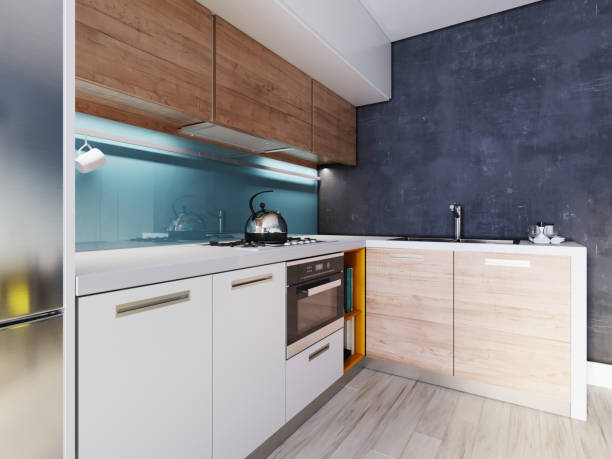istock Kitchen in blue and white color with a dining table, contemporary style. 1249340648